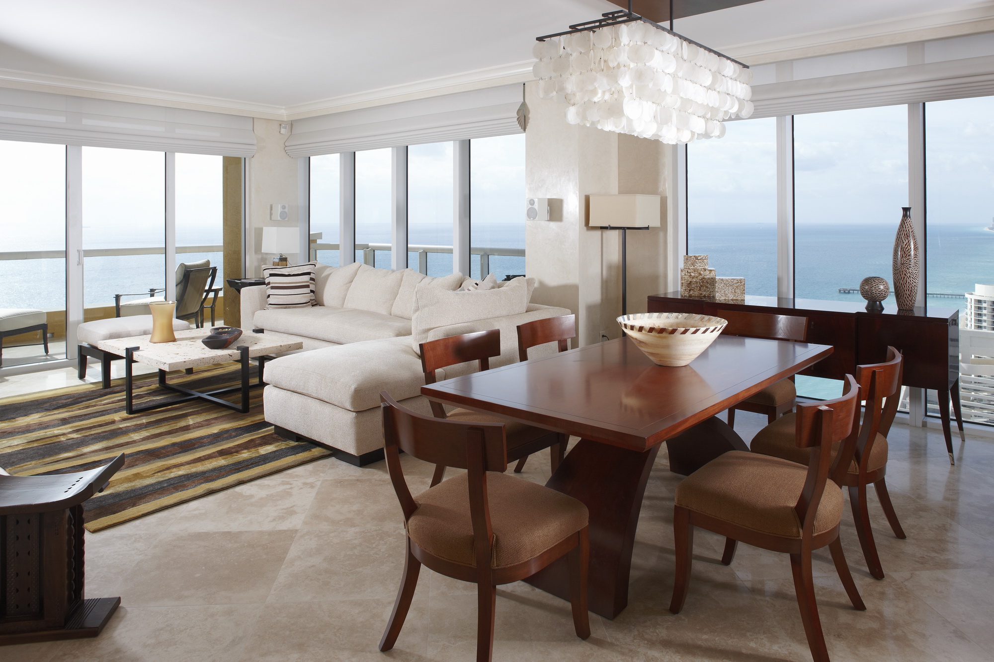 Sunny Isles condo dining and living space overlooking the ocean